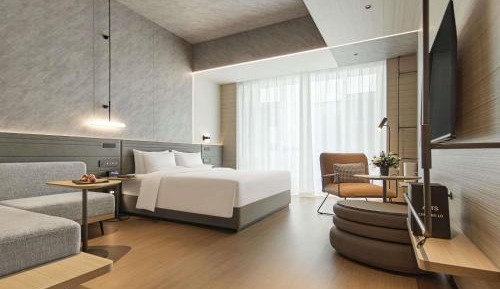 Superior Room One King Bed and A Sofa