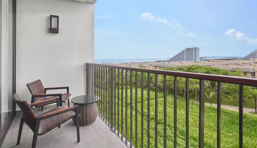 Deluxe Garden view with Two Double Beds and Balcony